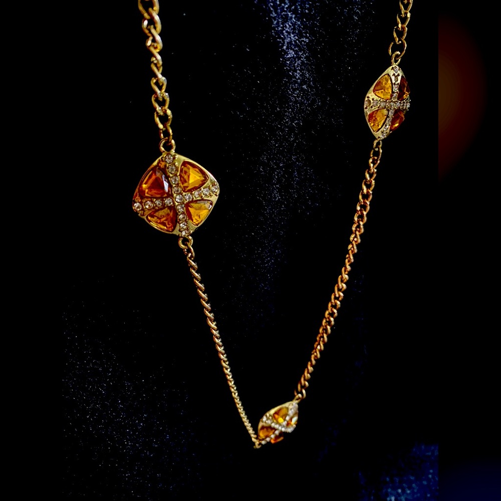 Long gold chain with 5 jeweled golden glass with rhinestones.